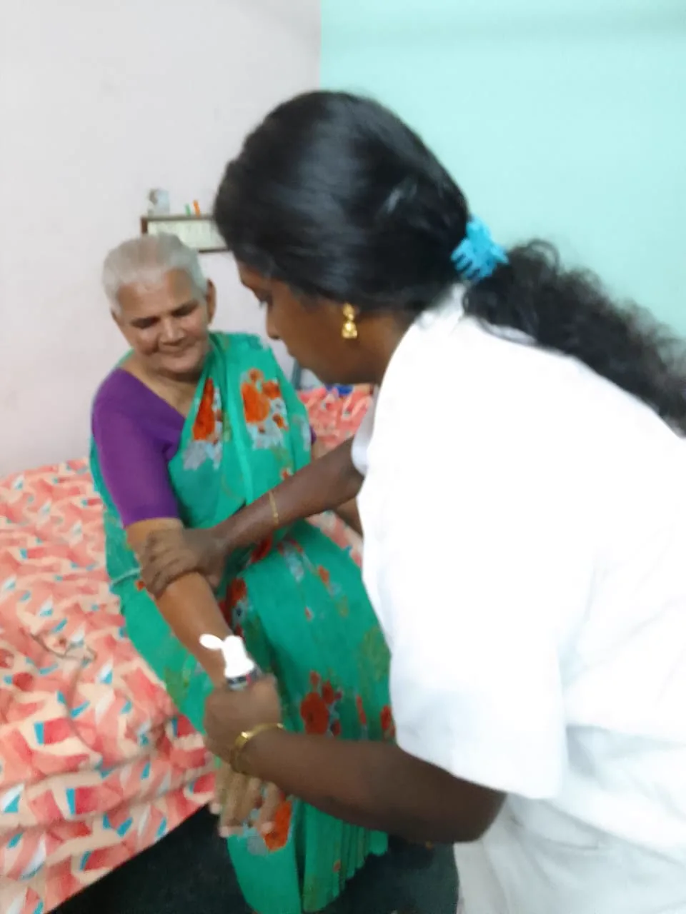 A caregiver sharing a warm moment with a resident